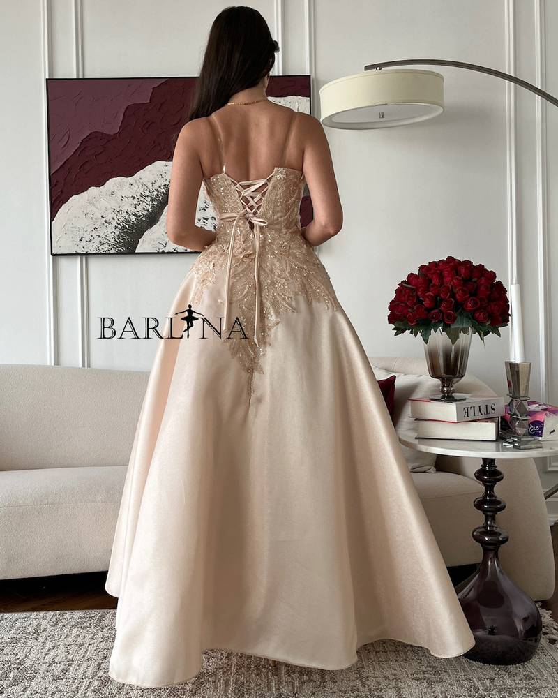 Elegant beige evening dress with back tie