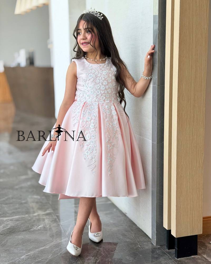 Pink girls' dress with a round back opening