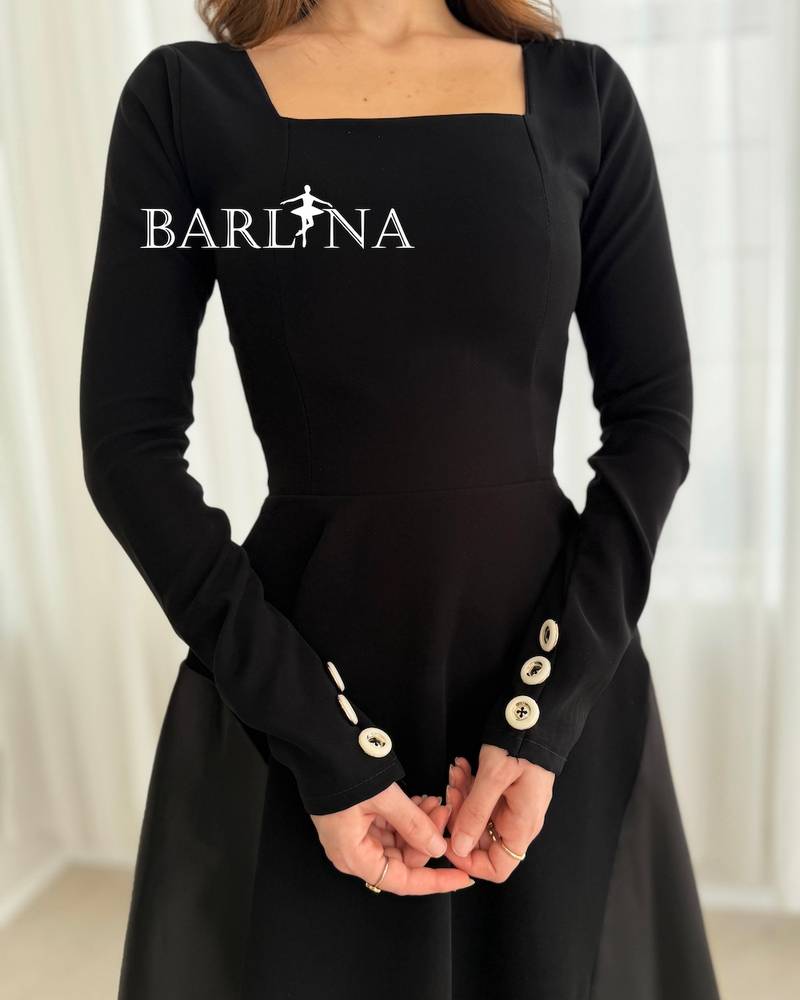 A simple black midi dress with a square neckline