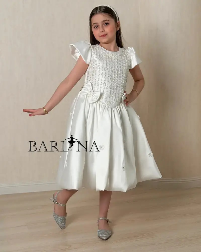 Luxurious white girls' dress adorned with sparkling beads