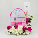 A pair of budgies with a cage decorated with colorful artificial flowers.04-code 14