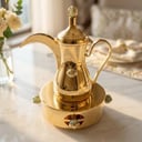 Gold plated Dallah with heater and Green precious stones 