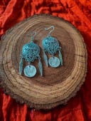 Silver color earrings with feathers