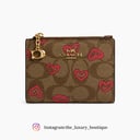 Coach bifold wallet with heart pattern