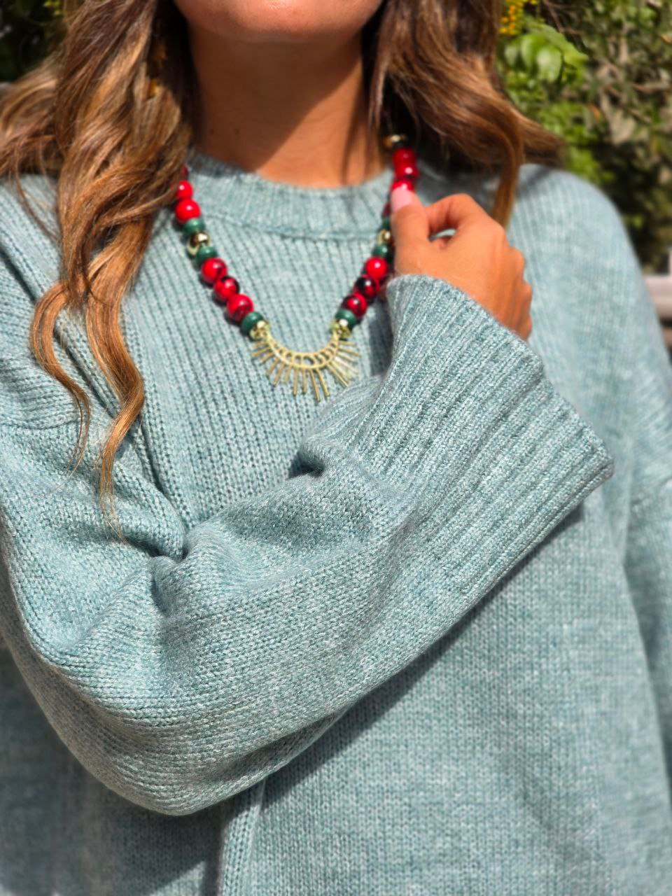 Red And Green Beaded Necklace With a Gold Toned Sun Burst Pendant  - Image 1