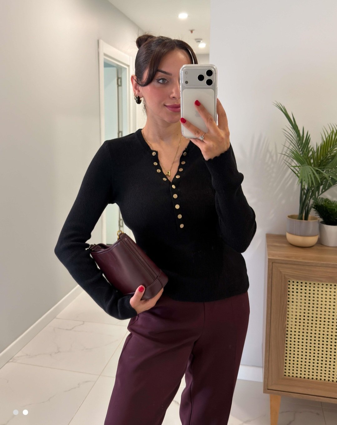 Black round neck top with gold buttons  - صورة 1