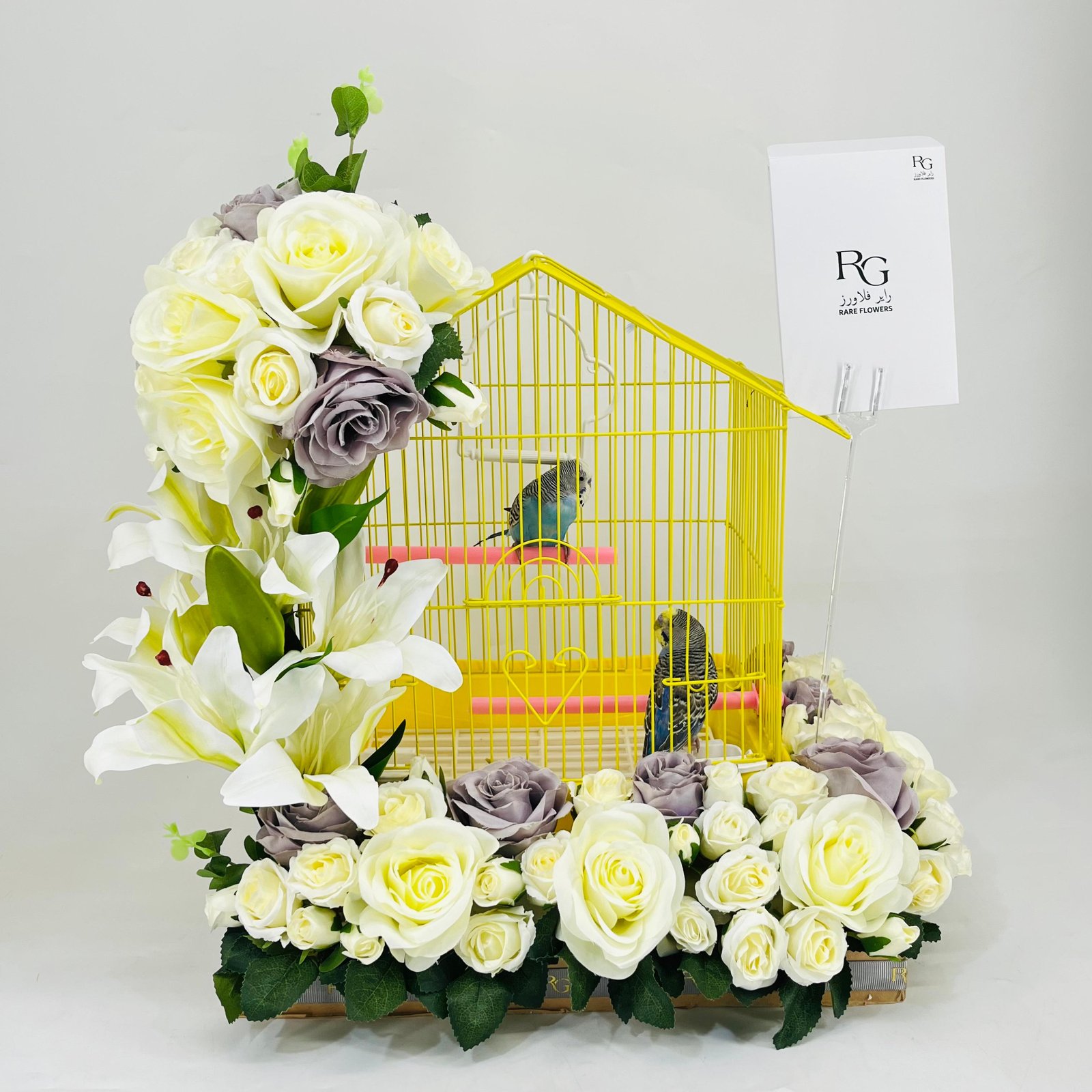 A pair of budgies with a cage decorated with colorful artificial flowers-219 - Image 1