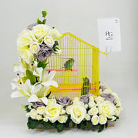A pair of budgies with a cage decorated with colorful artificial flowers-219 - Image 1
