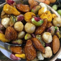 عسل بالمكسرات الطازجة والمقرمشة  ½ كيلو - صورة 1