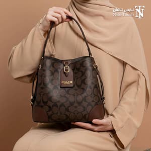 شنطة يد نسائية ماركة كوتش