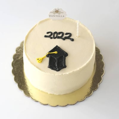 White Baby Graduation Cake