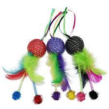 This is a Pet Vogue mesh ball cat toy with feathers and ribbons. 