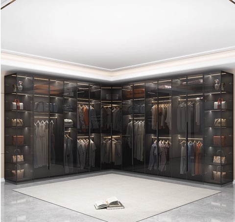 A glass wardrobe with a modern design and ample storage space.