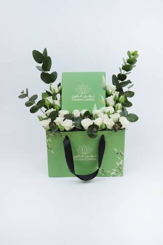 A box arranged with flowers and Tulin chocolates