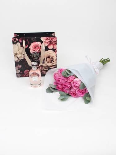 A distinctive vase and Givenchy L'Interdit perfume for women