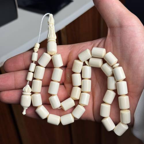White Cylindrical Koka Misbaha – With Elegant Carved Tassel