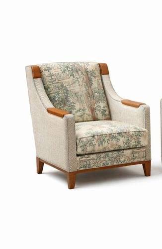 A luxurious classic chair with tapestry leather upholstery.