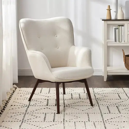 Fabric armchair in a creamy finish