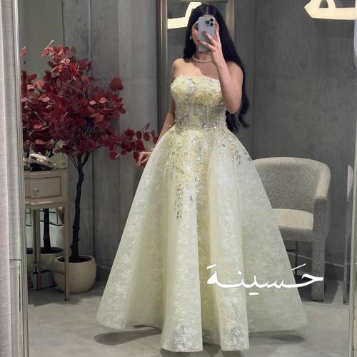فستان عاجي منفوش بتطريز لؤلؤي