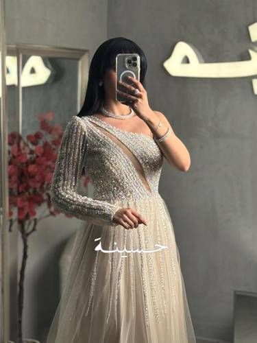 فستان سهرة تل مطرز بالكامل