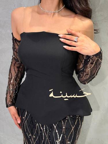 فستان سهرة أسود بتفاصيل مطرزة