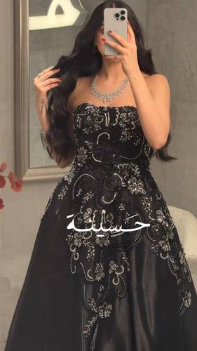 فستان اسود توب كلفه ذهبيه