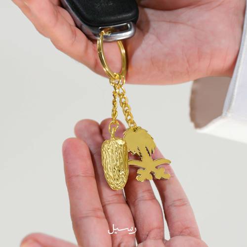 ميدالية تمرة و سيفين ونخلة 