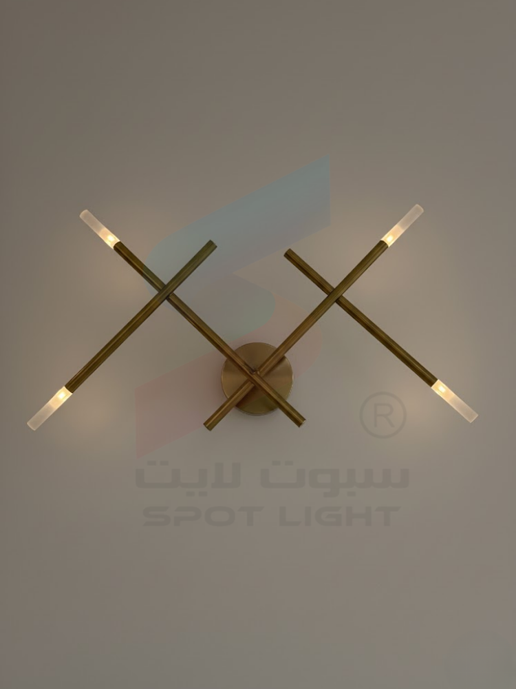 ابليك جداري مودرن ذهبي تصميم متقاطع واضاءة ناعمة