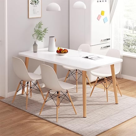 A rectangular dining table set with modern wooden legs of multiple sizes and plastic chairs in a modern and elegant design - White