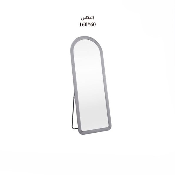  Elegant half-round standing mirror with grey frame in bright room 