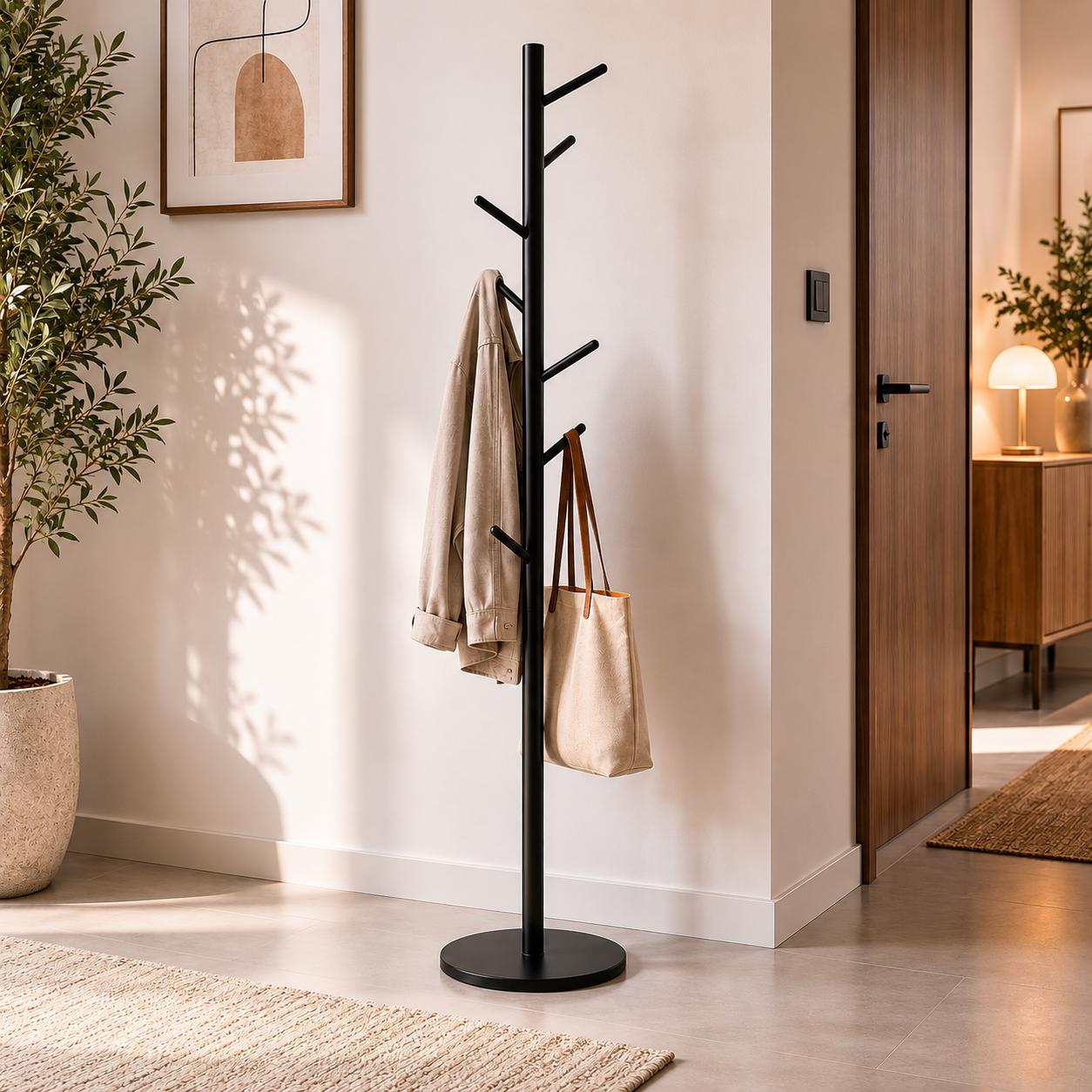  Black coat rack with round base in modern entryway 