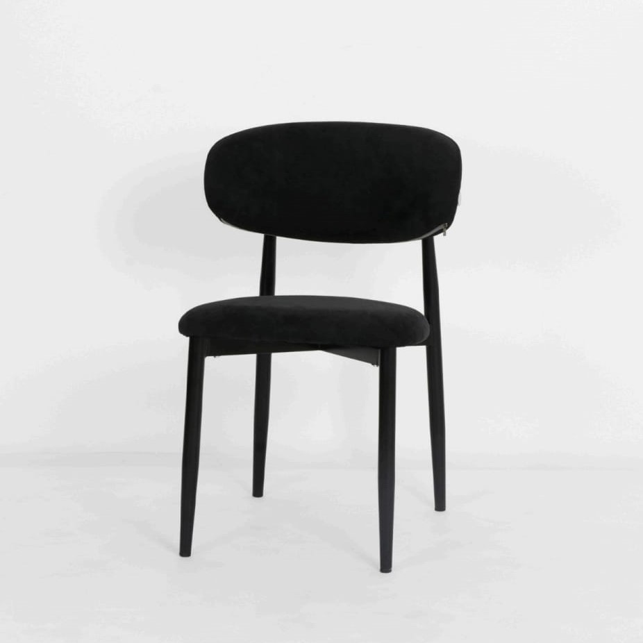  Black dining chair styled in a modern dining room setting 