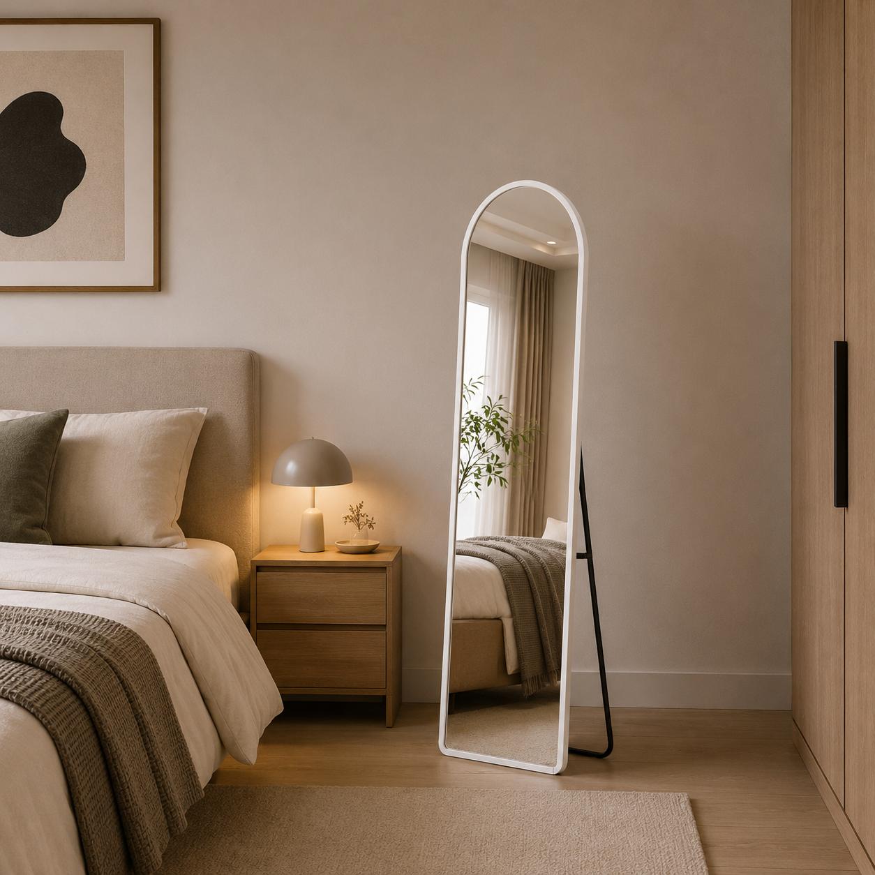  White arched standing mirror in modern bedroom 
