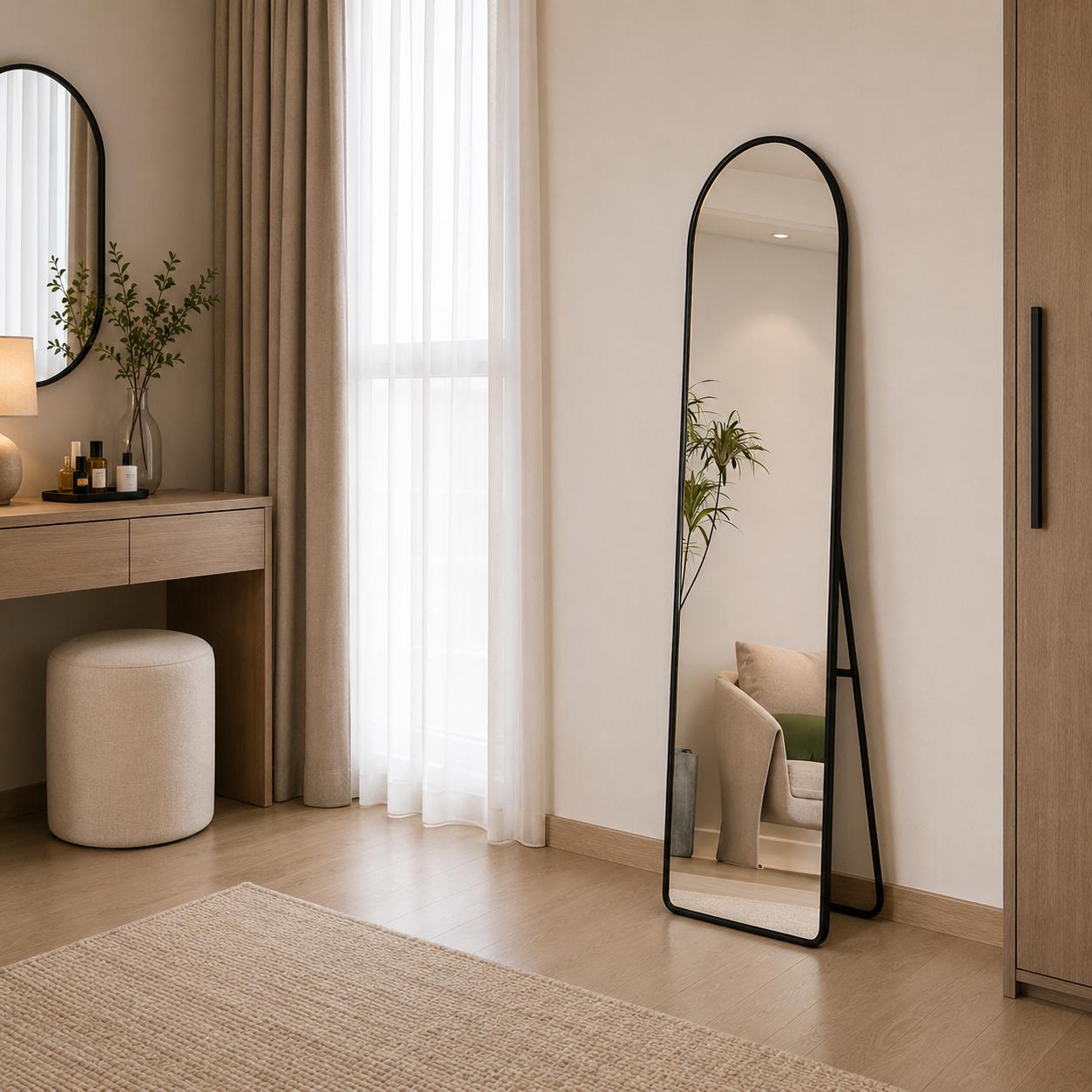  Black arched standing mirror in modern bedroom 