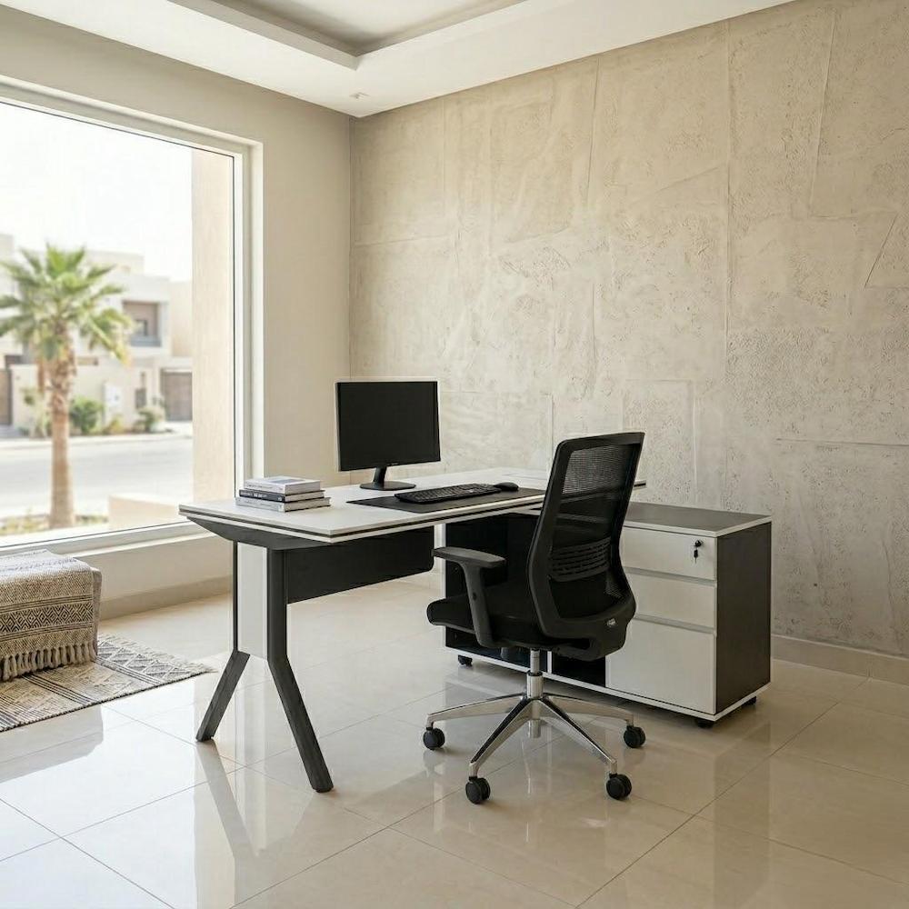  White work desk with dark gray base in a modern home office 