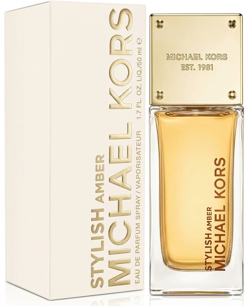 عطر مايكل كورس ستايلش امبر او دو بارفيوم نسائي بحجم 50 مل مع علبة التغليف على خلفية بيضاء - متجر حديقة العطور