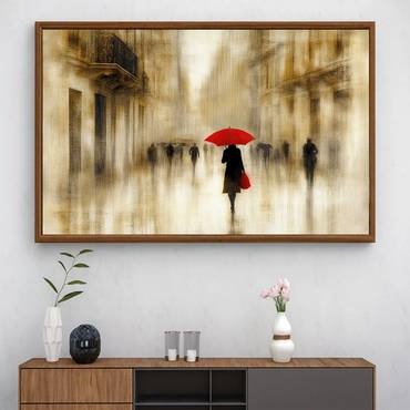    لوحة جدارية سيدة المطر معلّقة في صالة عصرية - لوحة فنية على كانفس بإطار بتصميم امرأة تحمل مظلة حمراء في مشهد شارع مطير بألوان ذهبية دافئة | Rovica