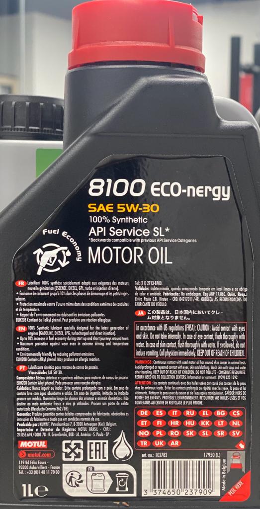 A black container with a red cap of Motul 8100 Eco-nergy 5W-30 100% Synthetic 1L