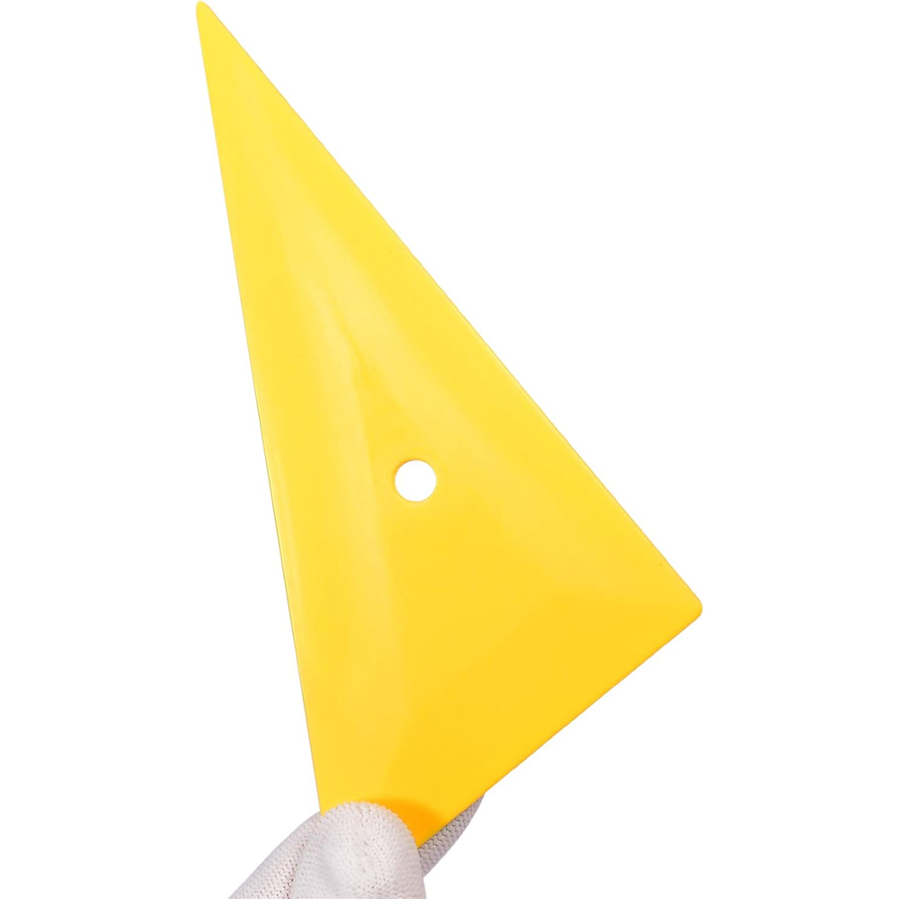 A rigid yellow triangular corner squeegee dedicated to tucking and smoothing protection and tinting films