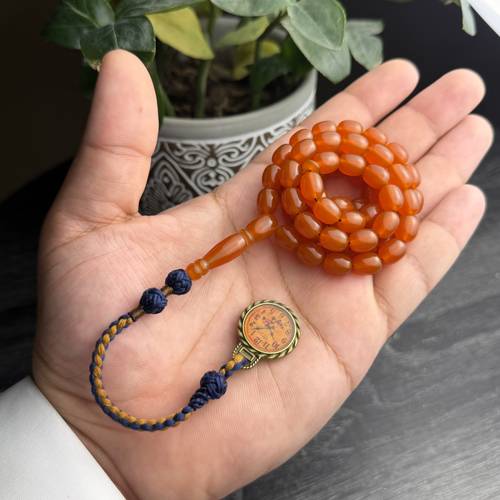 بكالايت بكركوشة قماش تفصيل خاص مضاف اليه معدن بتصميم ساعة