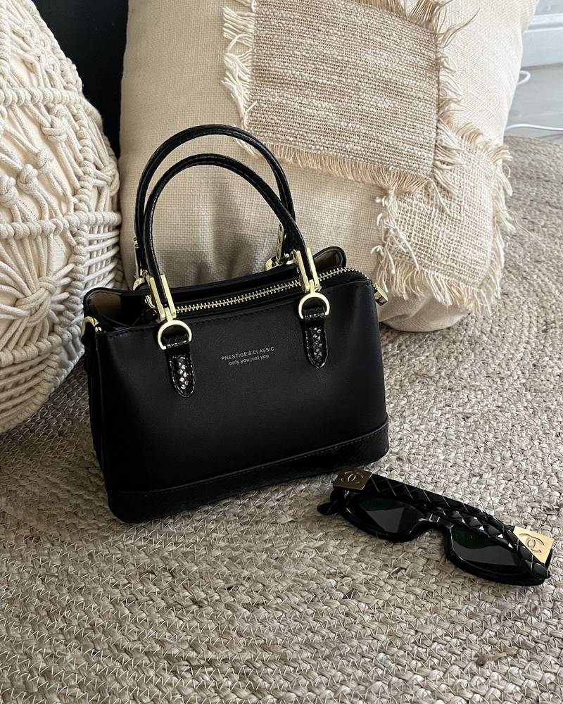 حقيبة جلد أسود مع محفظة طويلة