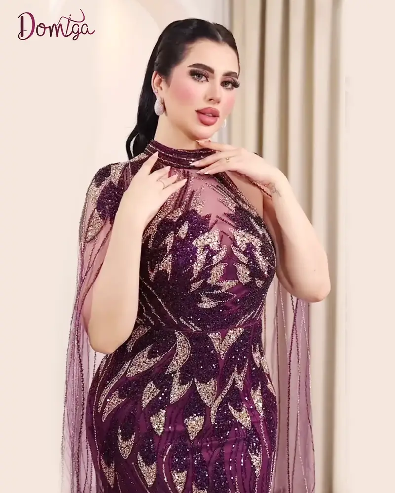فستان سهرة طويل موف بتول مطرّز وقصة سمكة وأكمام ملكية