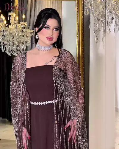 فستان سهرة بني تريندي تول مع كاب شفاف مطرز فاخر 