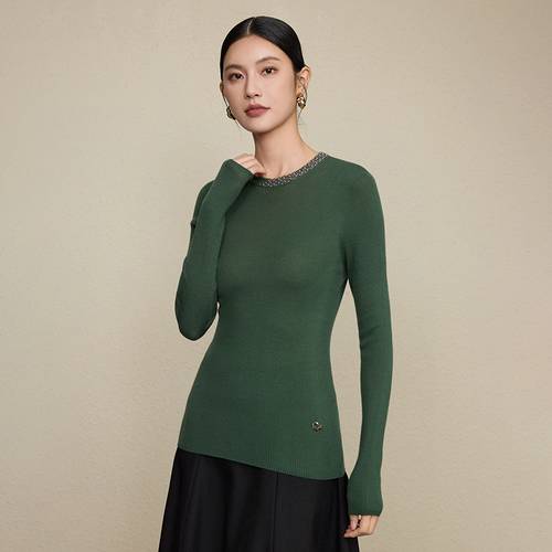 Ribbed knit sweater with a round neckline.