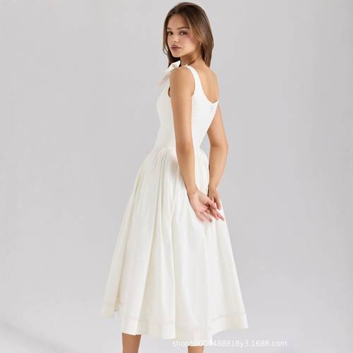 A dress with thin straps and a long skirt