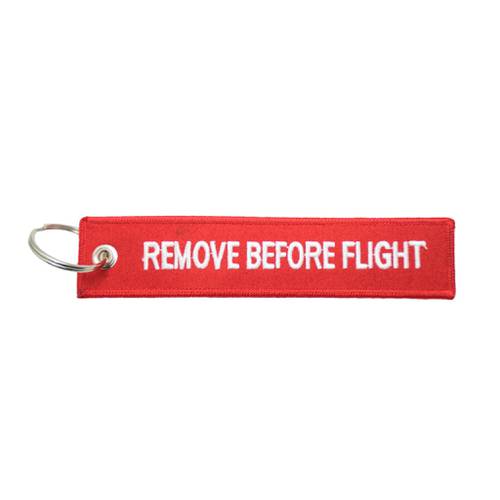 ميدالية مفاتيح REMOVE BEFORE FLIGHT باللون الأحمر