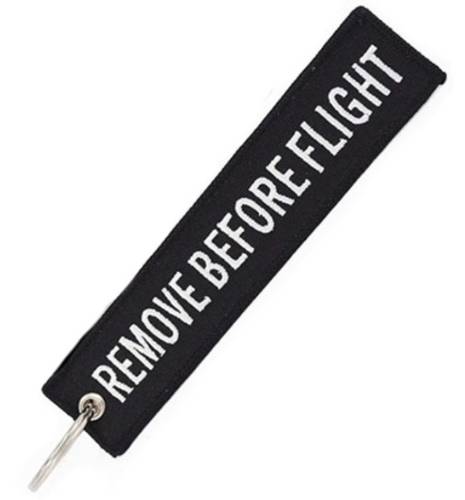 ميدالية مفاتيح REMOVE BEFORE FLIGHT قماشية - لون أسود / أبيض