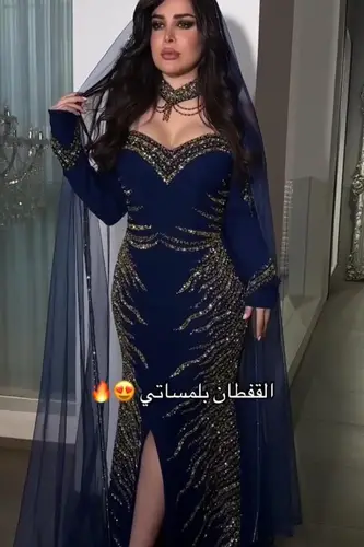 فستان كحلي باربي مطرز يدوي وشال تل تيواني