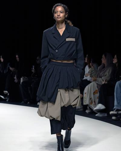 Black Jacket With Sleeves and Asymmetrical Beige Layered Skirt
