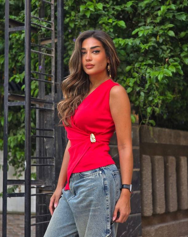 Red top with gold accessory 